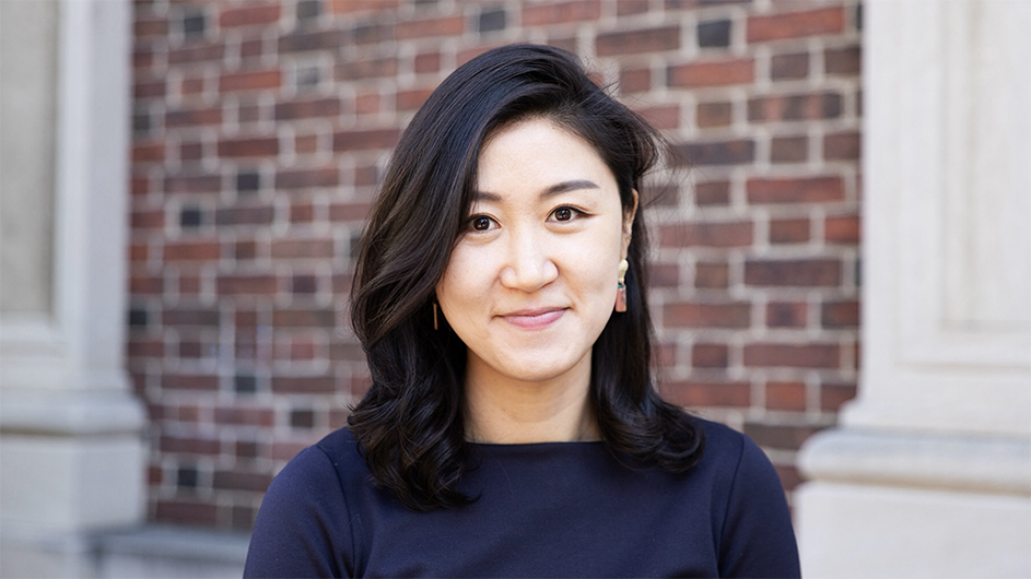Headshot image of Eunji Kim in front of a brick building with pillars.