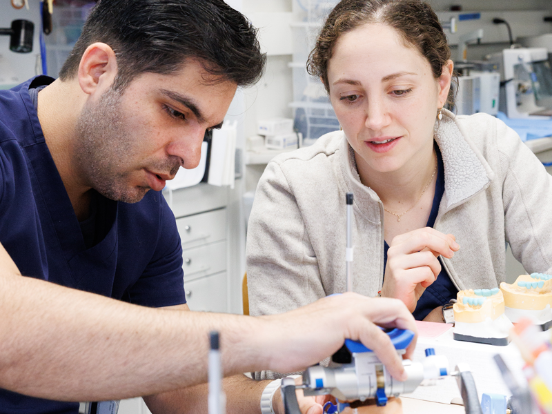 Dental Medicine Students working in a lab