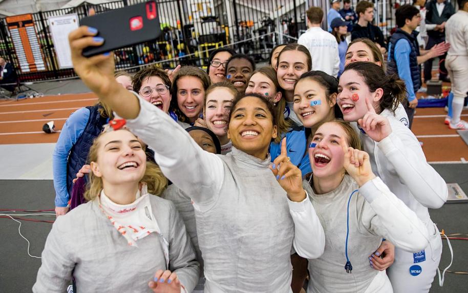 Student fencing athletes taking a selfie